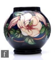 Rachel Bishop - Moorcroft Pottery - A vase of footed ovoid form with short collar rim, decorated