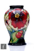 Philip Gibson - Moorcroft Pottery - A small vase of baluster form, shape 65/6, decorated in the Rose