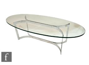 In the manner of Merrow Associates - An oval smoked glass coffee table raised to a chromium plated