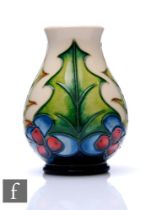 Philip Gibson - Moorcroft Pottery - A small vase of ovoid form with flared neck, decorated in the