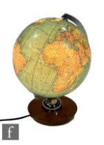 JRO Globus - A 1960s illuminated globe with chromed metalwork, raised on a wooden base, height 38cm.