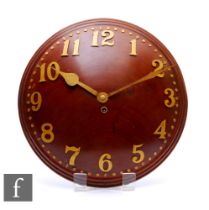 Heals - An Art Deco convex walnut wall clock with gilt metal Arabic numerals, diameter 34cm,
