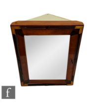 Unknown - A 1930s Art Deco wall mounted corner cupboard decorated with panels of tonal amber to