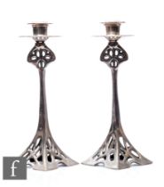 In the manner of WMF - A pair of Art Nouveau silver plated candlesticks, the pierced square