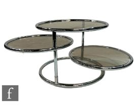 Attributed to Milo Baughman - A 1970s three-tier adjustable occasional or coffee table, with