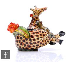 Ardmore Studio - An Ardmore Studio egg cup modelled as a recumbent giraffe with a monkey.