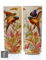 Montereau B & Cie - A pair of late 19th Century ceramic vases of footed sleeve form, each hand