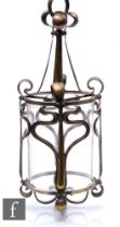 Unknown - An early 20th Century Art Nouveau pendant ceiling light, the sinuous brass cage supporting