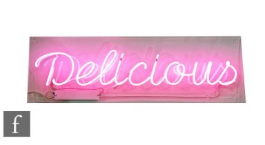 Unknown designer - A contemporary pink neon sign, 'Delicious', mounted to a clear acrylic panel,