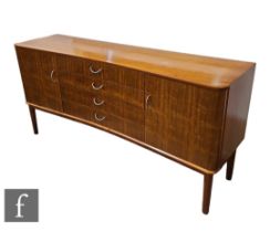 W.H Russell - Gordon Russell Furniture Ltd - A composed teak and Indian laurel dining suite, to