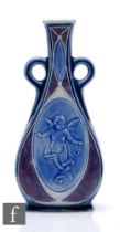 Leslie Harradine - Royal Doulton Lambeth - A stoneware flask vase of compressed shouldered form with