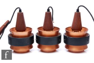 In the manner of Jorn Utzon - A set of three 1960s Danish pendant wall lights, the copper and