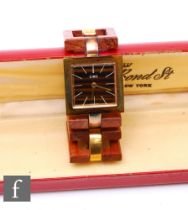 Ciro - A boxed vintage wristwatch, the square dial with a brown tortoiseshell effect with a wooden