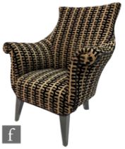 Unknown - An early 20th Century French Arm chair, the swept back falling to roll arms above a