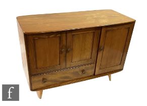 Lucian Ercolani for Ercol Furniture - A model 366 Windsor elm sideboard, fitted with a double door