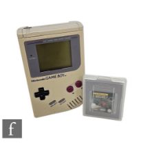 A Nintendo Game Boy, with two games, Tetris and Ferrari Grand Prix Challenge. (3)