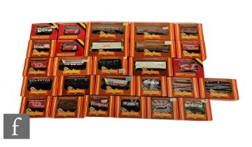 A collection of OO gauge Hornby rolling stock, to include plank wagons, tank wagons, mineral