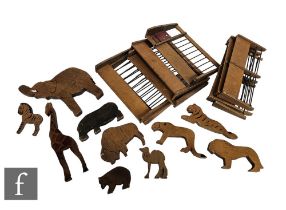 A collection of thirty seven handmade wooden zoo animals, with ten fencing sections.