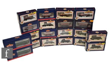 A collection of OO gauge Bachmann rolling stock, to include tank wagons, ore wagons, plank wagons,