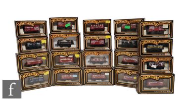 Twenty OO gauge Mainline items of rolling stock, mostly plank wagons and coke wagons, some