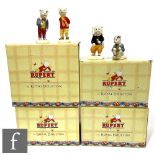 A collection of Rupert figures, comprising four boxed Royal Doulton with certificates, Rupert,