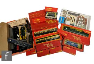 A collection of OO gauge items, mostly Triang to include boxed passenger coaches and rolling