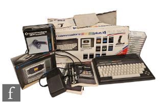 A Commodore Plus/4 with a selection of games and accessories, to include Exorcist, Treasure