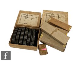 A collection of Trix Twin Railway accessories, including various track, buffer stops, uncoupling set