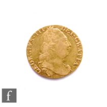 George III (1760-1820) - A Guinea, 1777, fourth laureate head right, reverse crowned garnished