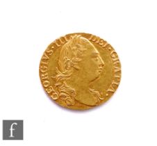 George III (1760-1820) - A Guinea, 1779, fourth laureate head right, reverse crowned garnished