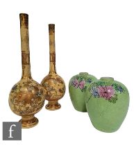 A pair of Chinese Qianlong style vases, of ovoid form impressed with scrolling tendrils, and