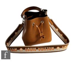 A Louis Vuitton NeoNoe tan Epi leather bucket bag, with monogram to the bottom right,