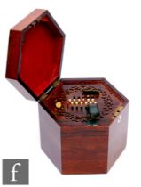 A late 19th to early 20th Century Wheatstone rosewood cased concertina, forty eight keys, green