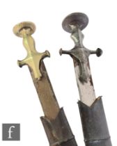 A pair of Indian Tulwar swords and leather scabbards, 76cm blades (2)