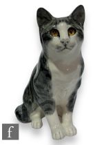 A large Winstanley cat by Mike Hinton, a seated silver tabby with white face and bib, hand painted