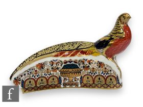 A Royal Crown Derby paperweight, The Golden Pheasant, gold stopper, printed mark, complete with box,