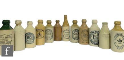 A collection of stoneware ginger beer bottles, to include a green top example Kings Barnes Horsham