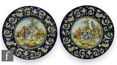 A near pair of 19th Century Italian Faience Ware charger in the manner of Cantagalli, each decorated