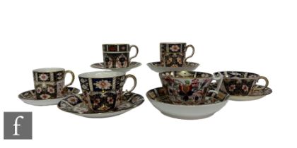 A collection of 19th and 20th Century Royal Crown Derby porcelain coffee and tea cups and saucers