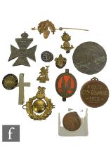 A group of early to mid 20th Century military and civilian cap and lapel badges, to include the