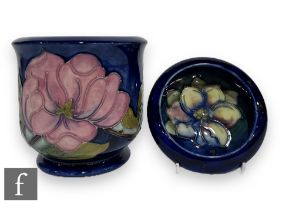 A post war Moorcroft Pottery jardinière of footed cylindrical form with roll rim, tube line