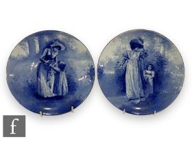 A pair of early 20th Century Royal Doulton dish form plates from the Blue Children series, each