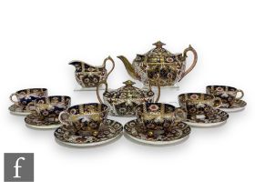 A late 19th Century Staffordshire tea service comprising boat shaped teapot, milk and sugar and