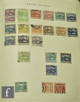 A collection of world postage stamps in albums, stock books and on album pages, including an Ideal