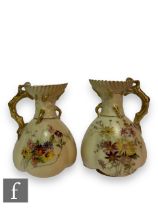 A near pair of Royal Worcester blush jugs, shape 1507, with quatrelobed body and flared neck with