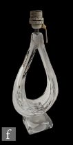 A mid 20th Century clear glass lamp of open tear drop form to a square base, height 46cm,