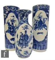 A collection of Chinese late Qing Dynasty blue and white vases, to include a pair of sleeve vases