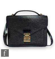 A 1990s Louis Vuitton black Epi leather Monceau crossbody bag, with front pocket, embossed logo at