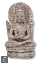 An Indian sandstone Buddha stele carving, carved in seated lotus position, raised on a lotus