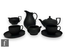 A collection of 19th Century and later Wedgwood black basalt wares to include a teapot of compressed